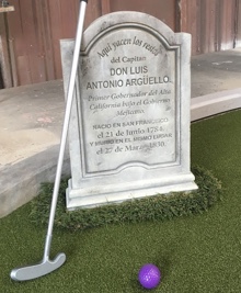 A tombstone with a putter